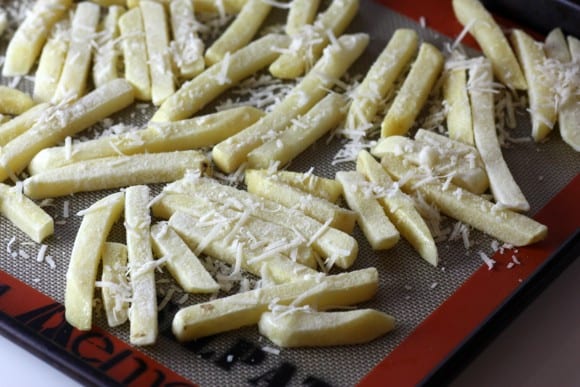 Parmesan on French fries before baking | CatchMyParty.com