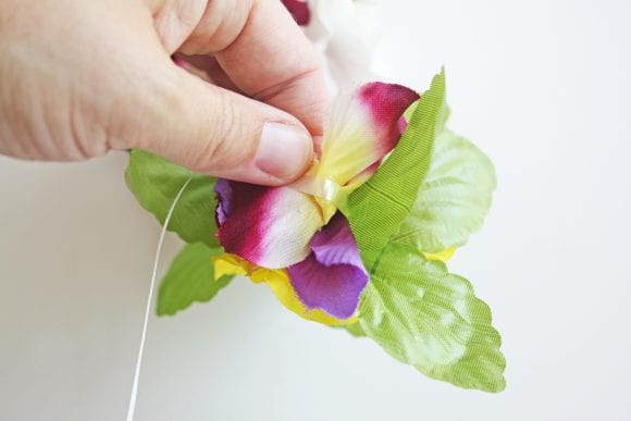 Attached glued flowers to the ribbon | CatchMyParty.com