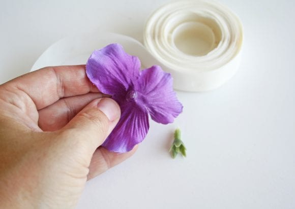 Pressed a glue dot at the base of the flower | CatchMyParty.com