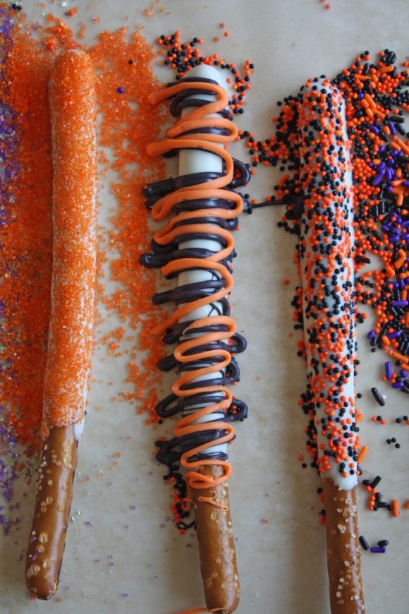 Pretzel Rods Sprinkled with Halloween Sprinkles | CatchMyParty.com
