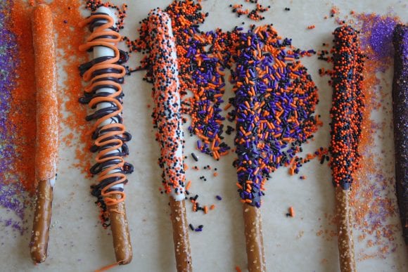 Pretzel Rods Sprinkled with Halloween Sprinkles | CatchMyParty.com