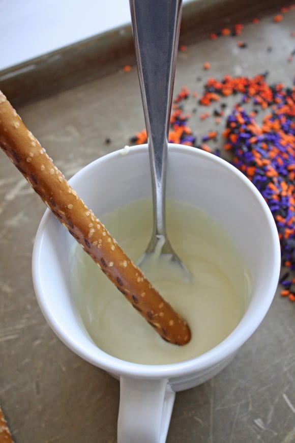Pretzel Rods Dipped into White Candy Melt | CatchMyParty.com