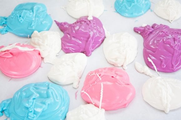 A spoonful of melted candy melts dropped on parchment paper | CatchMyParty.com