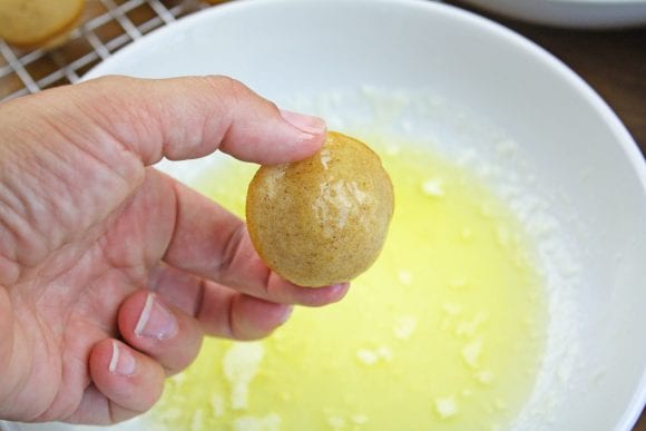 Rolled the donut holes in melted butter | CatchMyParty.com