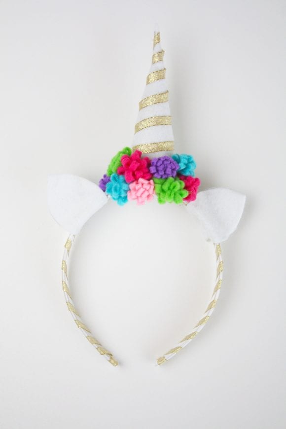 Cut out white felt ears and glued it to the headband | CatchMyParty.com