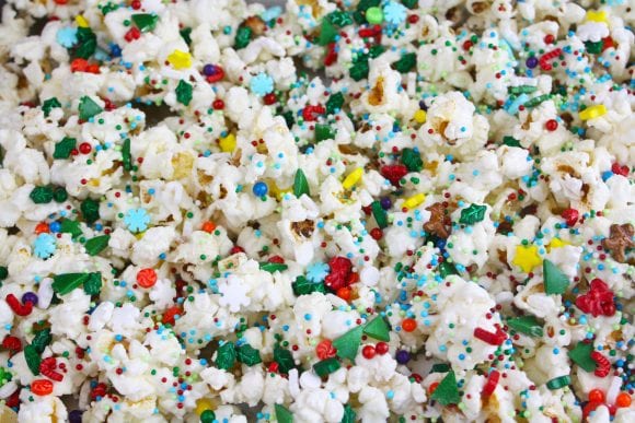 Add holiday sprinkles to the coated popcorn | CatchMyParty.com