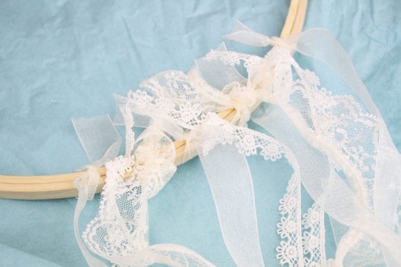 Tie the ribbon onto the bottom of the embroidery hoop | CatchMyParty.com