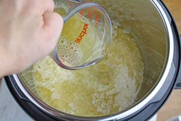 Add chicken broth to rice | CatchMyParty.com