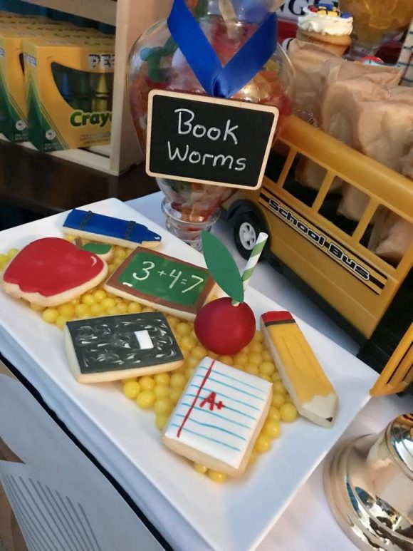 The cool mix of school themed sugar-coated cookies such as a ruler, notebook, pencil, apple and more