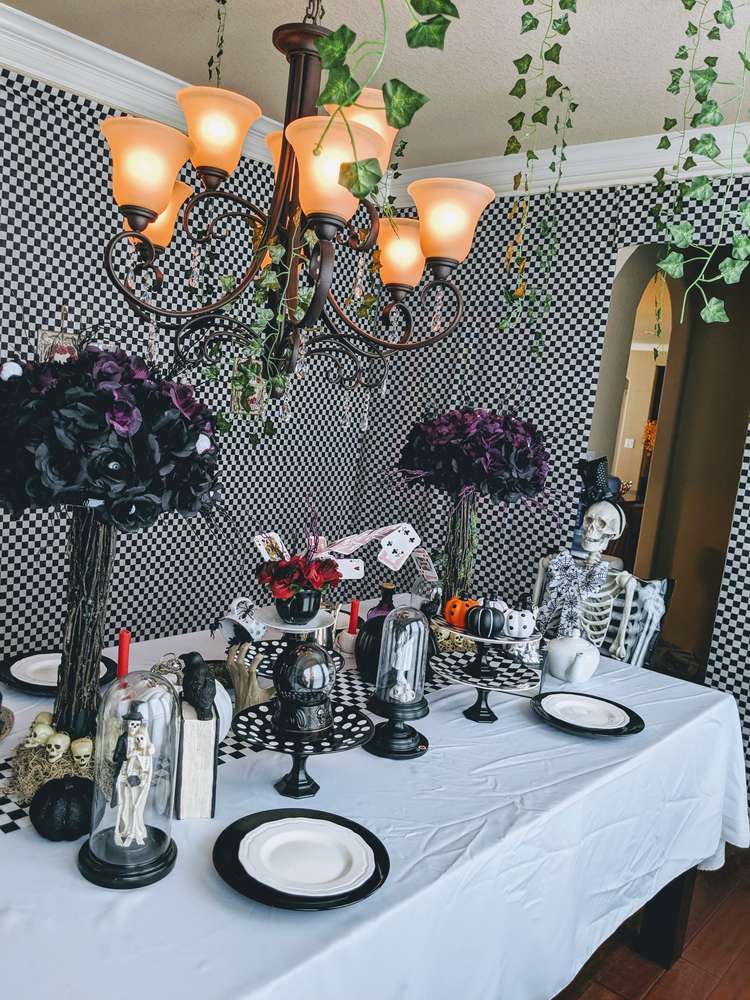Spooky table settings at a fabulous Alice in Wonderland Halloween Tea Party