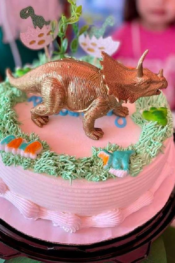 Pink and Gold Triceratops Cake