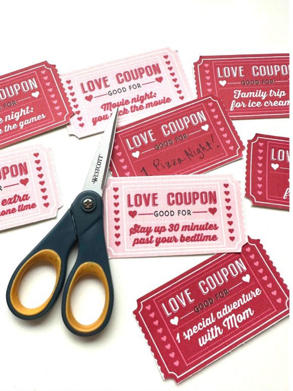 Cutting out free love coupons for kids for Valentine's Day. Great gift.