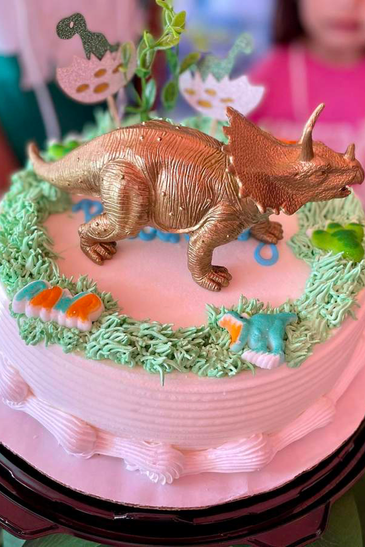 Pink and Gold Triceratops Cake