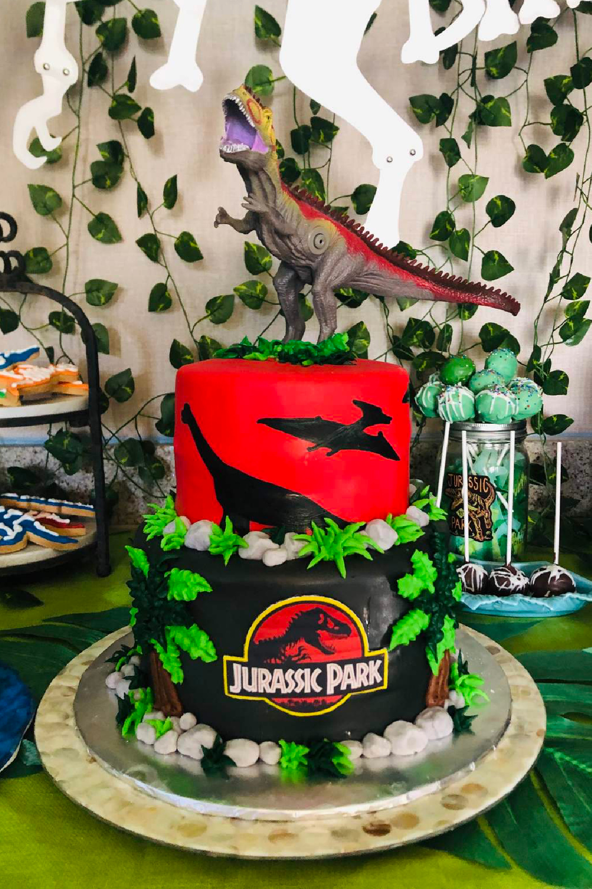 Red and Black Jurassic Park Dinosaur Cake